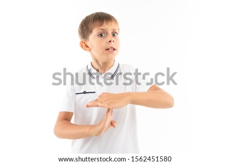 A little blonde boy shows timeout, picture isolated on white background