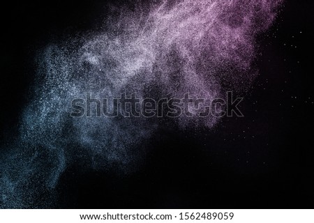 purple and blue ocean powder color splash for makeup artist or graphic design in black background, look like a lively and joyful mood.