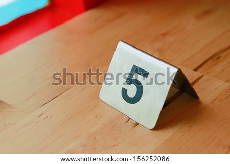 the metal board that screen number 5 Royalty-Free Stock Photo #156252086