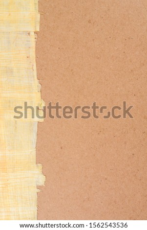 Empty cardboard background with old authentic Egyptian papyrus paper on left side. Mockup for the design.