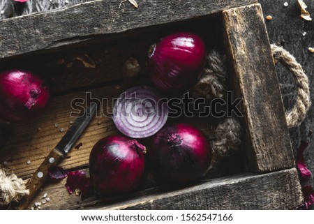 detail of onion inside the box with dark background. Wholesome healthy food