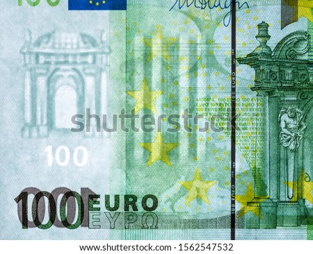 Watermark on a banknote of 100 euros macro close-up. Translucent 100 Euro banknote with visible watermarks.