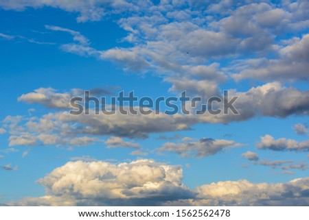 Beautiful sky with heavy, rainy clouds. Bright clouds. Sky background. 