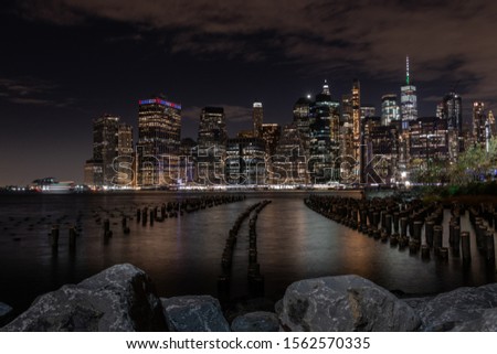 Manhattan by night as seen from old pier 1 in Brooklyn