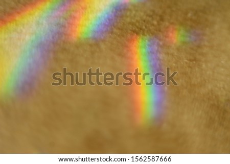 spectral colors in highlights on a beige background