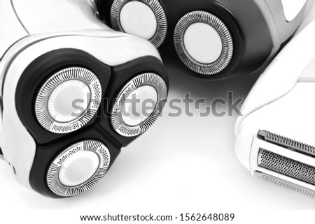 Three shavers close-up. Black and white style.
