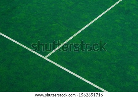Tennis court indoor with green carpet surface