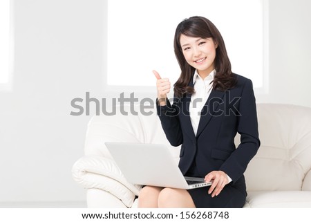 Beautiful young asian woman using laptop