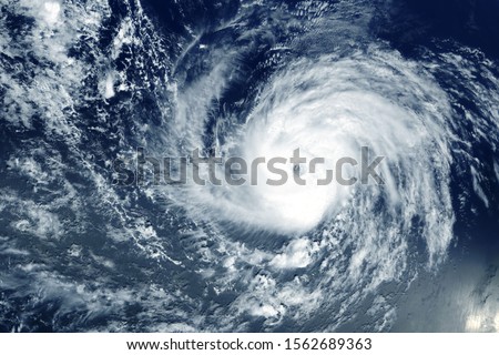 Typhoon from space near the coast. Elements of this image were furnished by NASA. Royalty-Free Stock Photo #1562689363