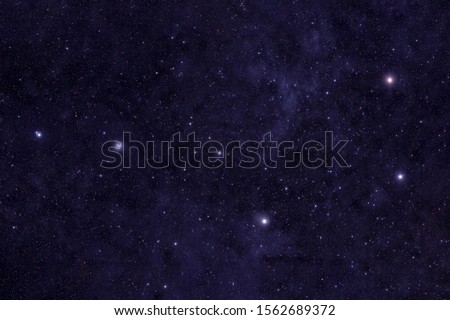 Big Dipper, against the backdrop of the nebula. Elements of this image were furnished by NASA. Royalty-Free Stock Photo #1562689372