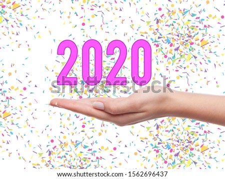2020 year numbers in woman's hand . 2020 year trends concept.