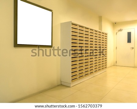 white small billboard with mail boxes in first floor of condominium