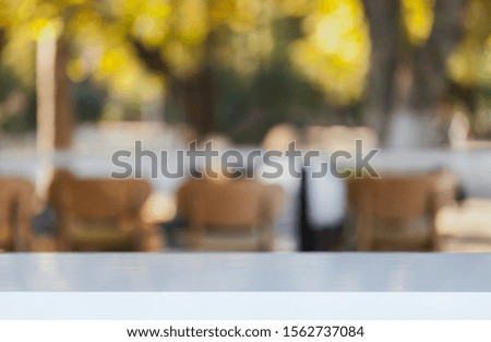 Wooden desk on bokeh blur abstract natural background