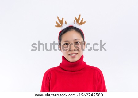 Cute red-haired girl in stylish winter hat expressing happiness in christmas. Attractive young woman in sweater and skirt enjoying new year photoshoot.