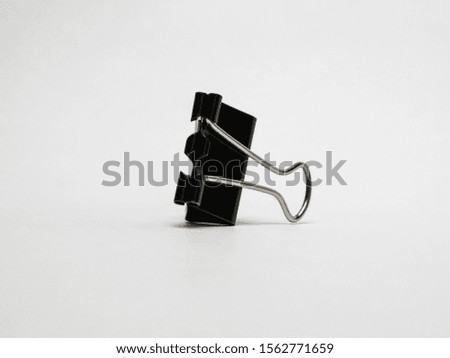 Black Paper clip isolated on white background. High Resolution