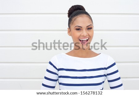 Closeup horizontal portrait of a happy young woman laughing 