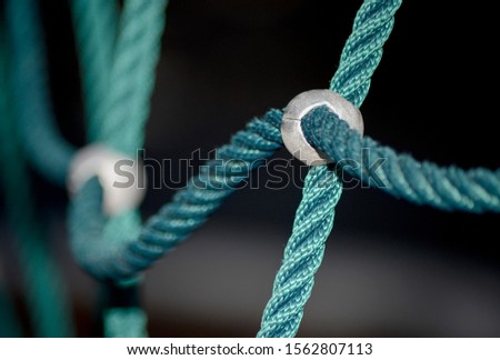 Ropes bound together with metal attachments on a playground
