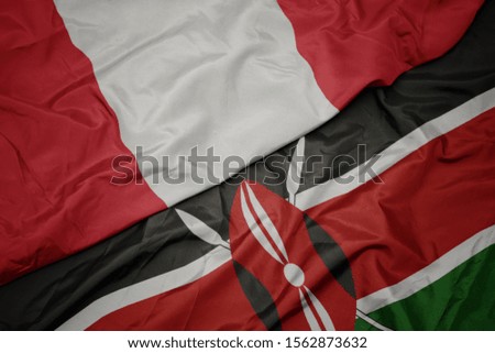 waving colorful flag of kenya and national flag of peru. macro
