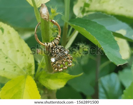 Pair of gold colour metal earring