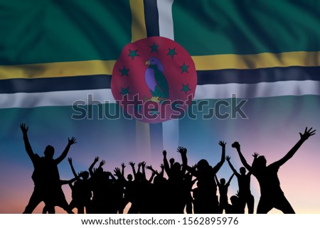 Peoples silhouette on flag and sky background, day of Dominica, independence holiday 