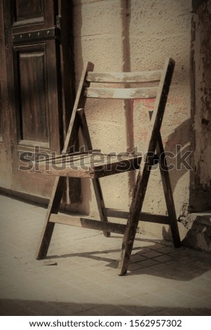Old wooden folding chair on a sidewalk in Mar Mikhael Beirut