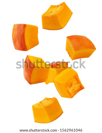 Falling piece of pumpkin, cubes, isolated on white background, clipping path, full depth of field