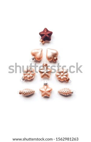 Creative composition of a Christmas tree from decorative ornaments. Flat lay, pastel. Minimalism.