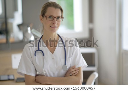nurse facing camera in an office