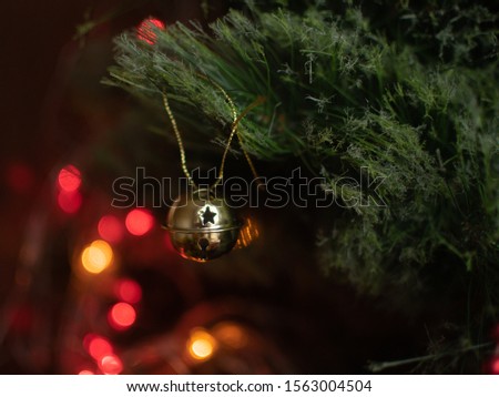 Christmas bell hanging on the tree