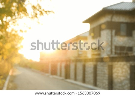 Blurred photo of beautiful houses. Banner for advertisement