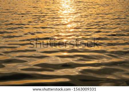 Surface of the water with sunset