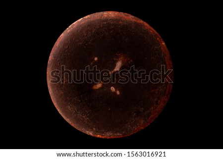 Abstract image of planet Venus from the surface of an old griddle on a black background in space. 