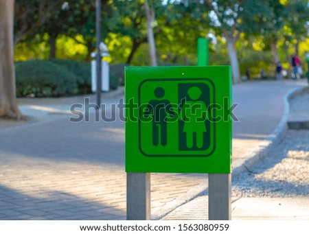 his and her sign in Benalmadena, Spain. Parque De La Paloma / Paloma Park. For public toilet