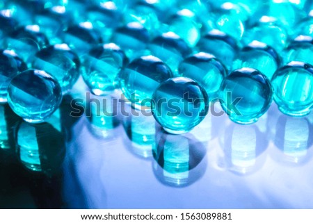 Blurred soft focus christmas background of gel balls. Macro of round hydrogel. Beautiful wallpaper