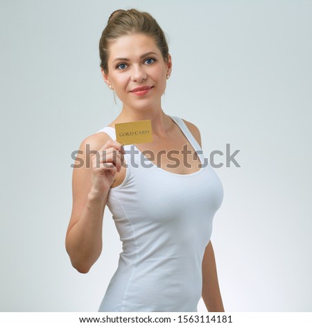 Smiling woman in white strap vest holding credit card. isolated female portrait.