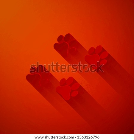 Paper cut Paw print icon isolated on red background. Dog or cat paw print. Animal track. Paper art style. Vector Illustration