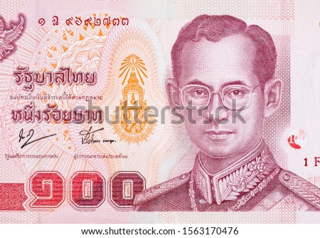 King Bhumibol Adulyadej on 100 Baht Thailand money bill close up