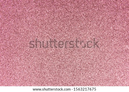 Blurred rose gold sparkling shiny paper Christmas holiday.
Abstract photo of bokeh pink champagne sparkle glitter texture background.
Blur sheet paper light red metal pattern valentine day.