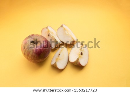 Apple isolated on yellow background