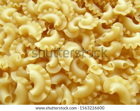 Shaped pasta background. Macaroni close up food. Cooking food.