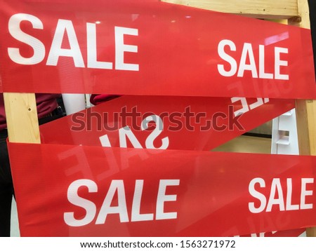 Shopping sale background.Discount label on the red ribbon.