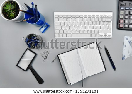 Workplace in the office. Equipment and office supplies on the desk.