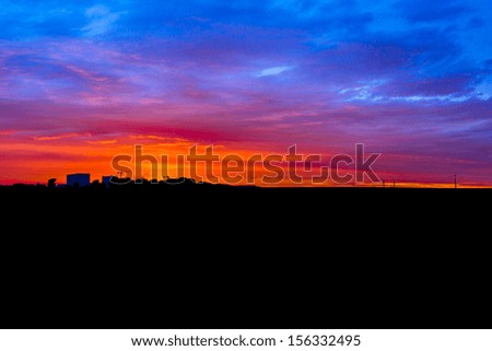 factory and wind power silhouette with Clouds in the light of the sunset 