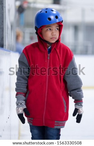 The child is practicing ice skating.