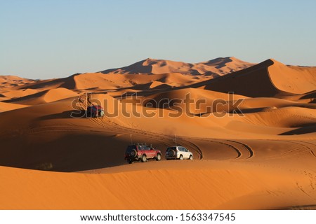 off road car driving in the Sahara desert near Merzouga in Morocco Royalty-Free Stock Photo #1563347545