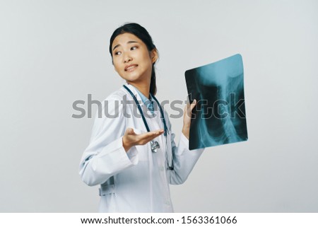 Doctor x-ray profession Asian appearance medical gown