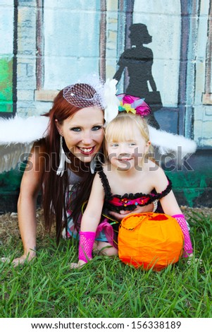 Mother and daughter pose for a Halloween picture
