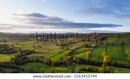 Beautiful aerial drone landscape image of Peak District countryside at sunrise on Autumn Fall morning