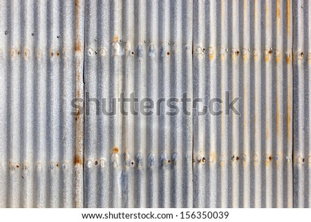 Rusted, galvanized, corrugated iron siding, vintage background. Royalty-Free Stock Photo #156350039