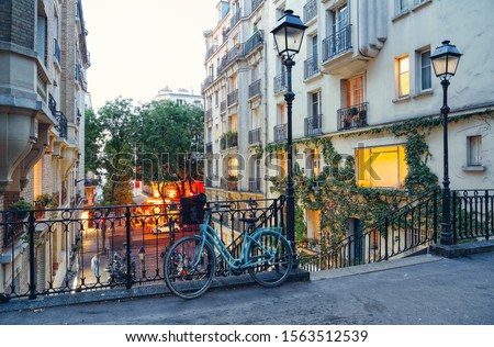 Bike and staircase in Montmartre, Paris Royalty-Free Stock Photo #1563512539